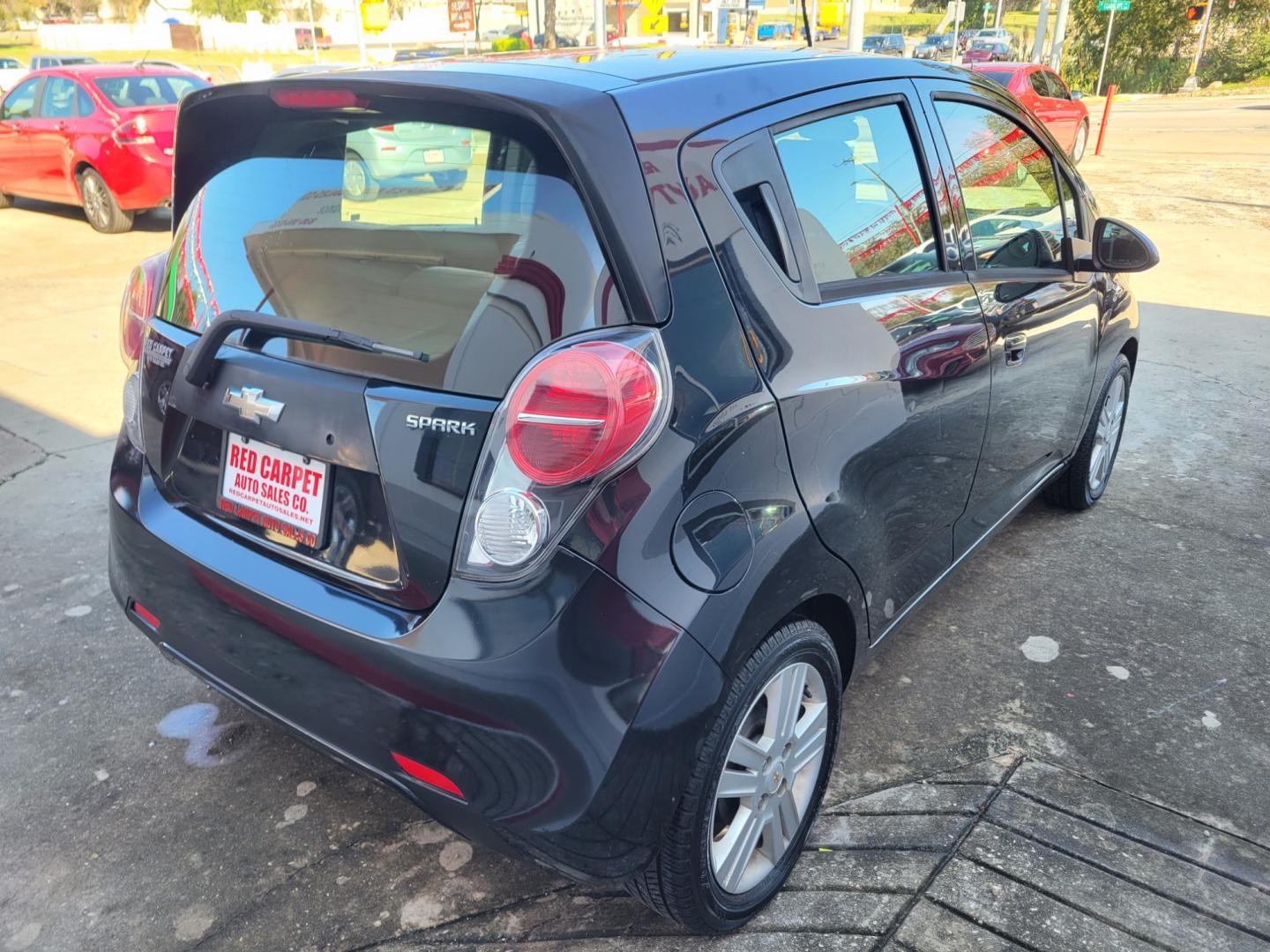 2015 BLACK Chevrolet Spark LS CVT (KL8CB6S98FC) with an 1.2L L4 16V DOHC engine, Continuously Variable Transmission transmission, located at 503 West Court, Seguin, TX, 78155, (830) 379-3373, 29.568621, -97.969803 - 2015 Chevrolet Spark LS CVT with a 1.2L L4 16V DOHC, Automatic, Tilt, AM/FM/AUX Stereo, Power Windows and Locks, Onstar Capability, Alloys Wheels, Rear Wiper, Rear Defroster and more!! - Photo#2